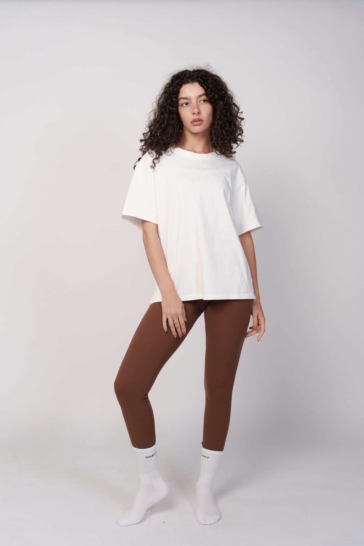 OAMY Seamless UltraSculpt Legging in Brown, styled with an oversized white t-shirt