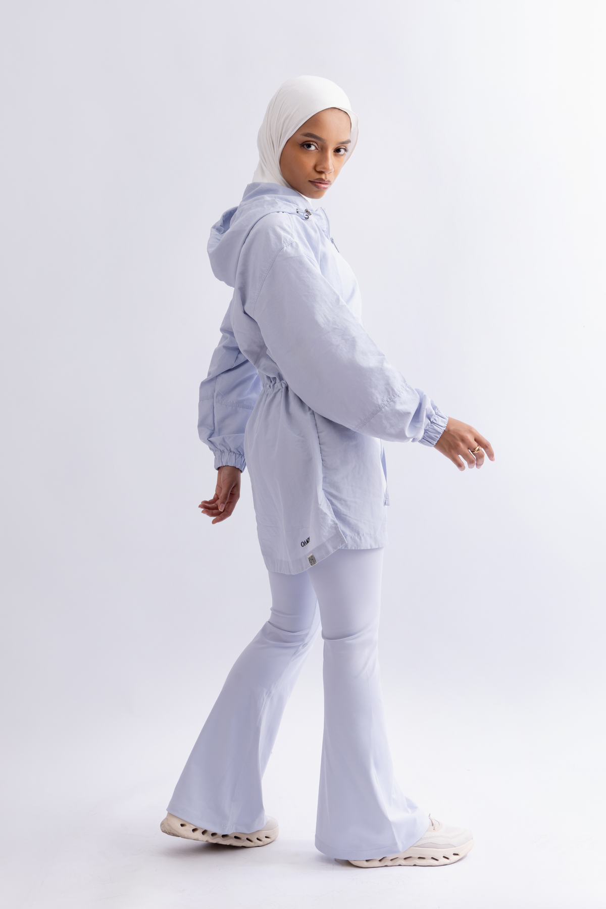 OAMY Relaxed Zip Jacket in Baby Blue, worn with flared pants