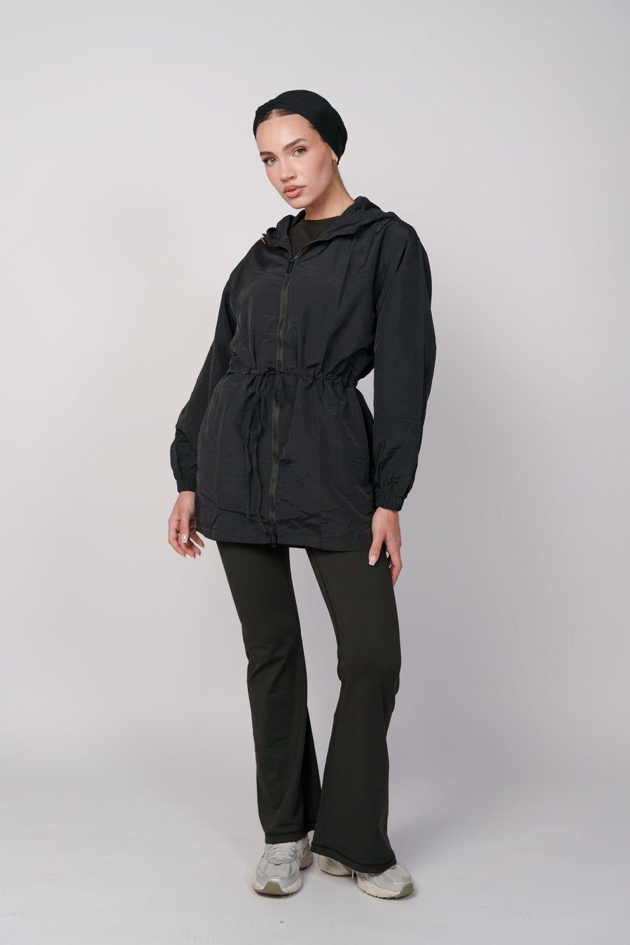 OAMY Relaxed Zip Jacket in black, worn open over a training top as an autumn layering piece