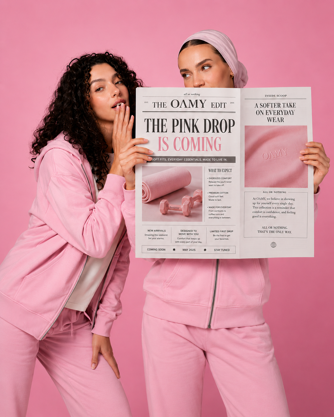 Two women in pink outfits holding a newspaper with pink text on a pink background