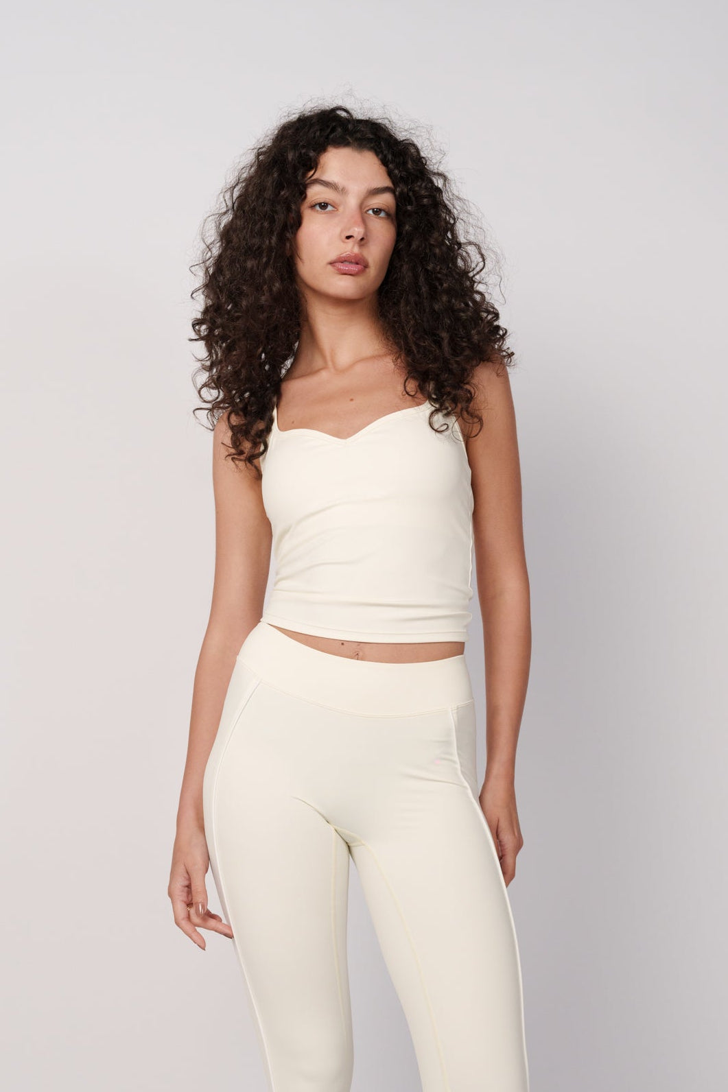 OAMY Sweetheart Strap Top in Butter Yellow, worn with matching leggings
