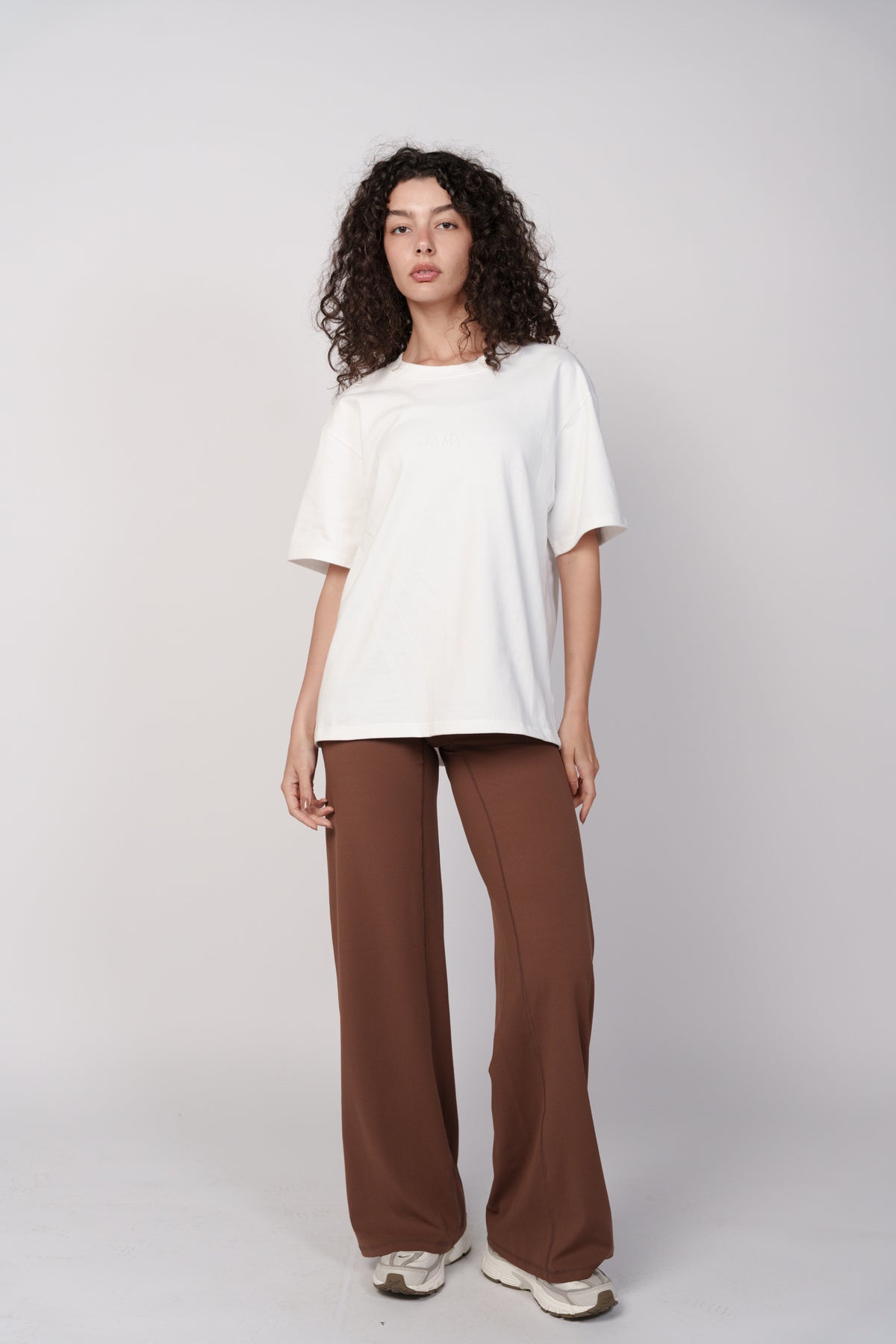 OAMY Wide Flare Pants in Brown, styled with a white top