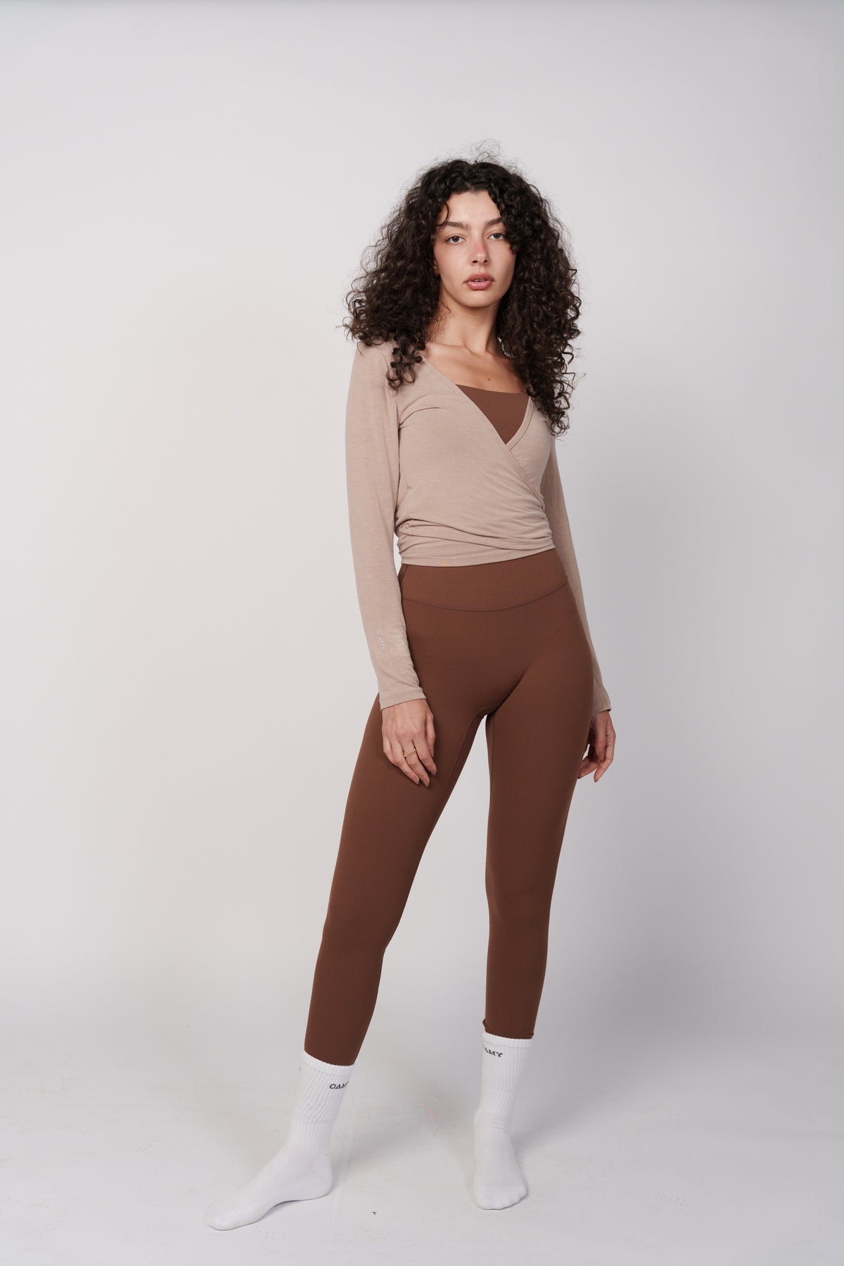 OAMY Ballet Wrap Top in Mocha, styled with brown leggings