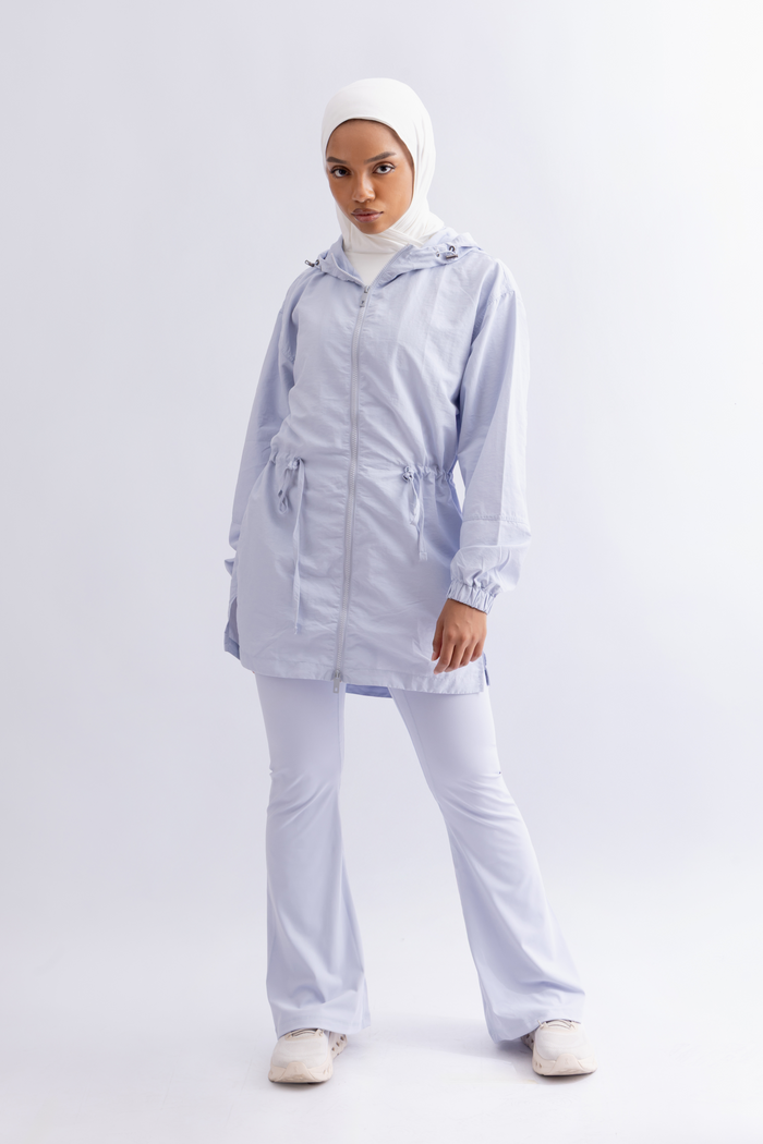 OAMY Relaxed Zip Jacket in Baby Blue, worn with flared pants