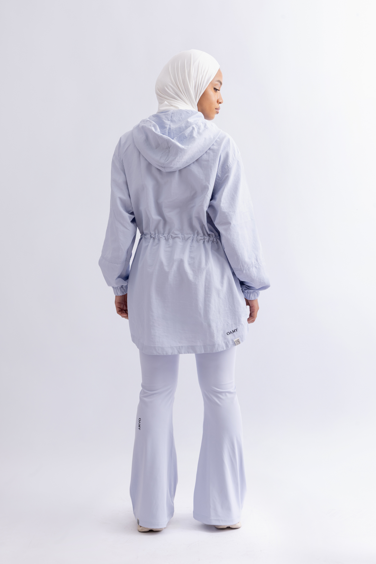 OAMY Relaxed Zip Jacket in Baby Blue, worn with flared pants
