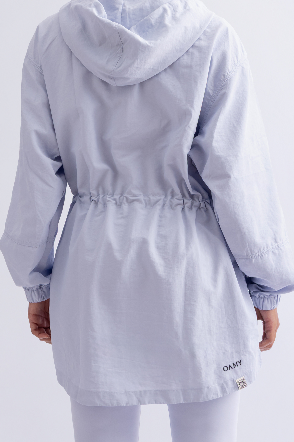 OAMY Relaxed Zip Jacket in Baby Blue, worn with flared pants