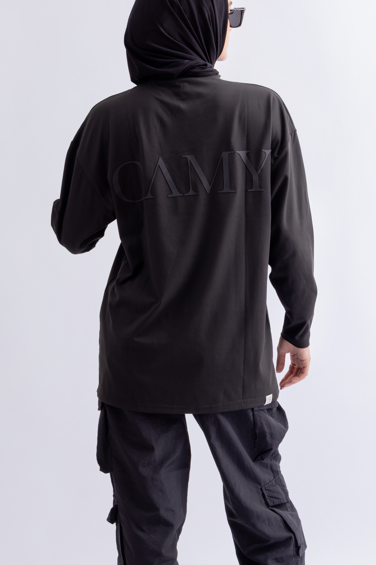 OAMY Oversized Long Soft Skin Sleeve Top in Black, styled with the Adjustable Straight Pant in Black