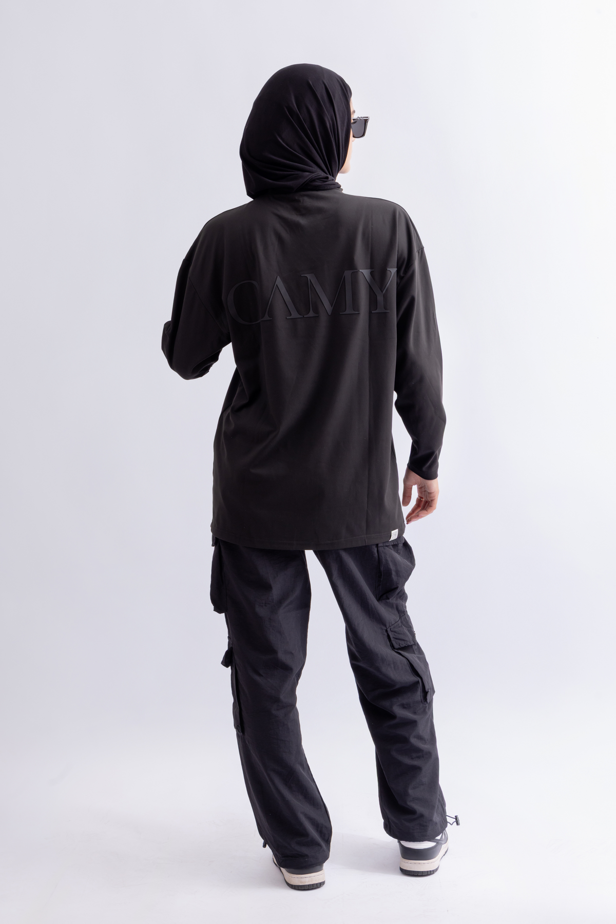 OAMY Oversized Long Soft Skin Sleeve Top in Black, styled with the Adjustable Straight Pant in Black