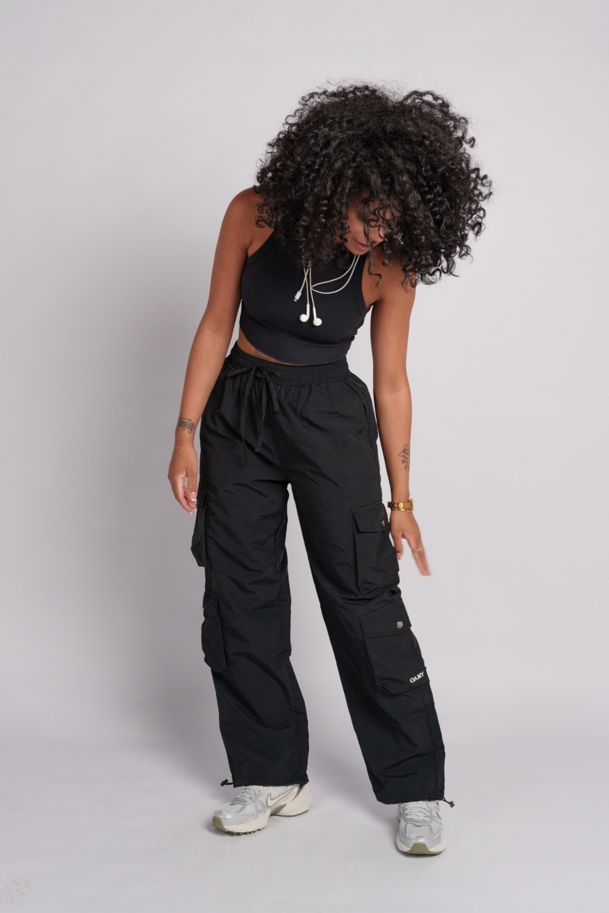 OAMY Adjustable Cargo Pant in Black, worn with the Soft-Skin Padded Crop