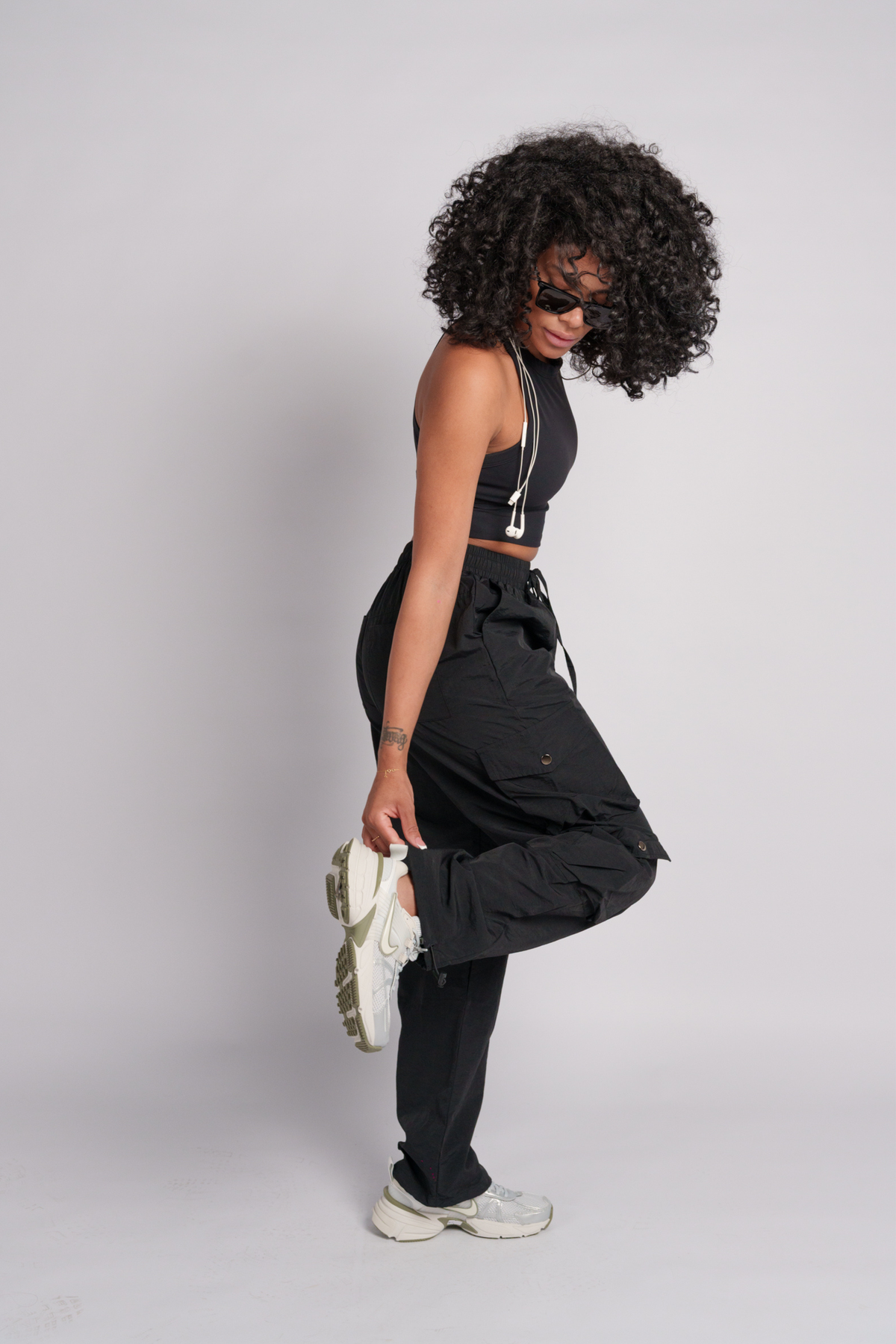 OAMY Adjustable Cargo Pant in Black, worn with the Soft-Skin Padded Crop