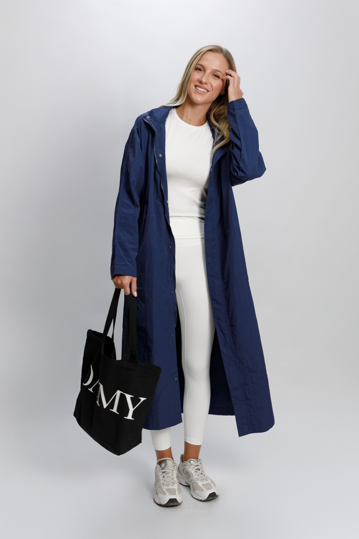 OAMY Relaxed Longline Zip Jacket in Navy, styled with the Tote Bag in Black