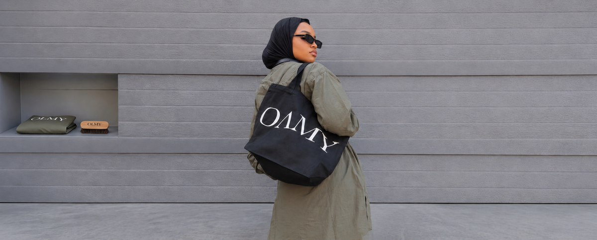 Woman wearing an OAMY olive jacket